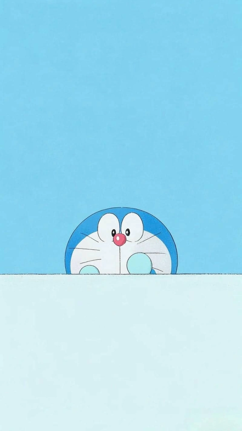 Hình nền Doraemon cute cho máy tính đang ngồi ăn bánh rán Dorayaki yêu thích.